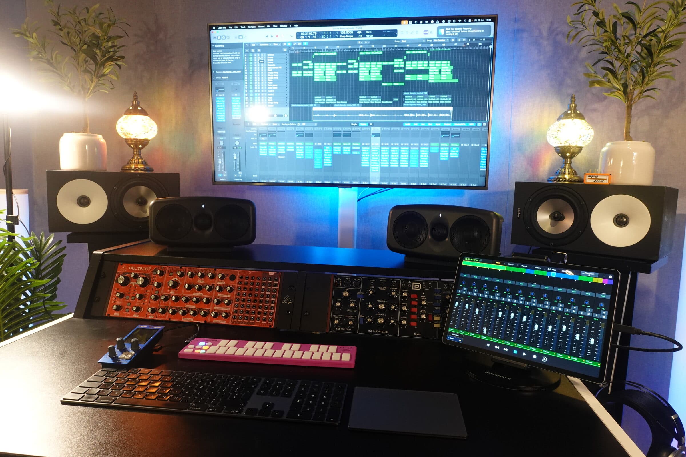 Straight-on view of the mastering room from the listening position: Amphion monitors, iLoud MTM pair, session display and synth shelf